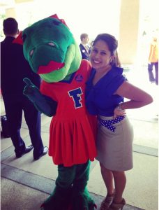 Image of Loren Parra with Alberta, UF's female alligator mascot